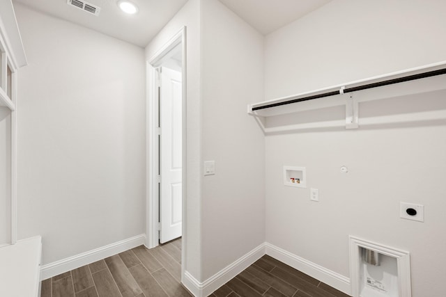 clothes washing area featuring gas dryer hookup, washer hookup, and hookup for an electric dryer