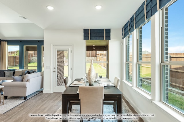 dining area with hardwood / wood-style floors