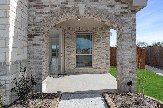 doorway to property with a patio area