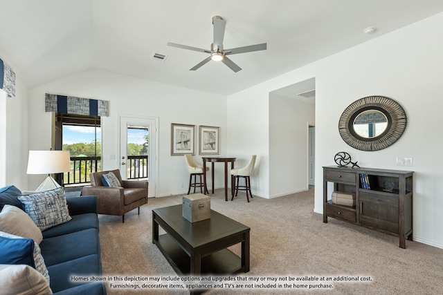 carpeted living room featuring ceiling fan and vaulted ceiling