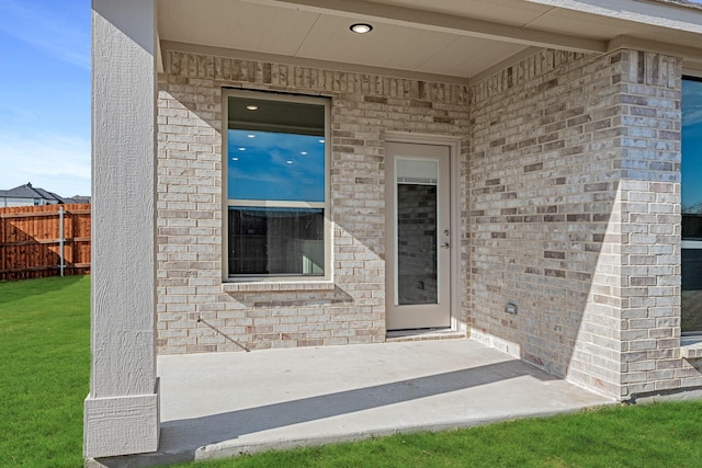 entrance to property with a patio area