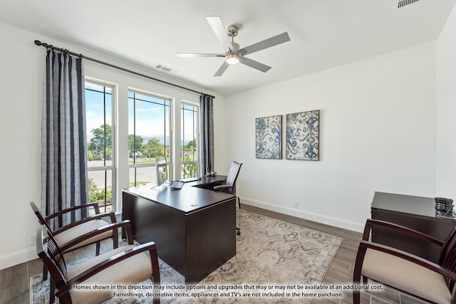 office area featuring dark hardwood / wood-style floors and ceiling fan