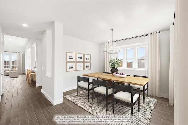 dining space featuring dark hardwood / wood-style floors and a notable chandelier