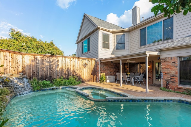 view of swimming pool featuring an in ground hot tub and a patio area