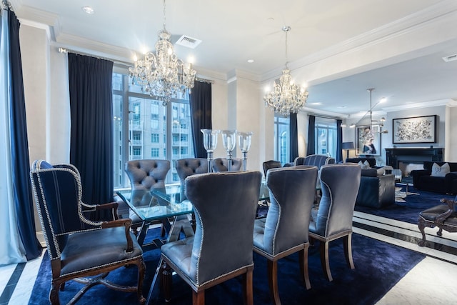 dining area with an inviting chandelier, plenty of natural light, and crown molding