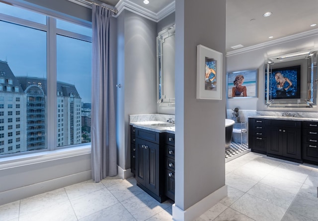 bathroom featuring a tub to relax in, vanity, and crown molding