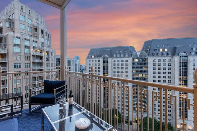 view of balcony at dusk