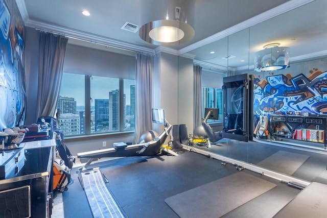 exercise room featuring ornamental molding