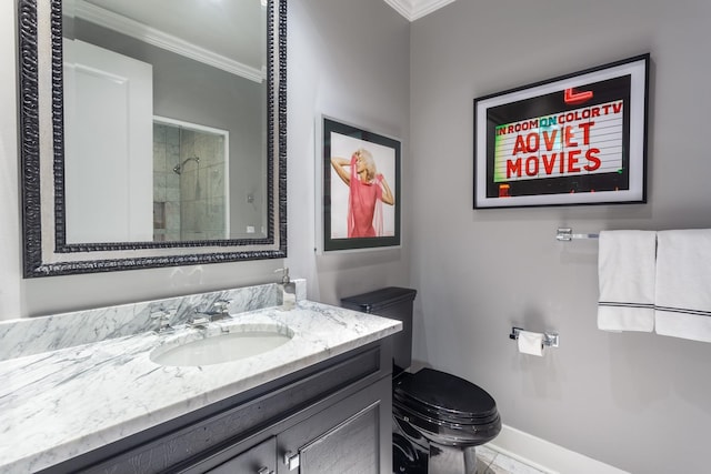 bathroom featuring crown molding, vanity, toilet, and a shower