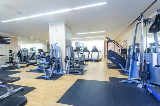 workout area with hardwood / wood-style floors