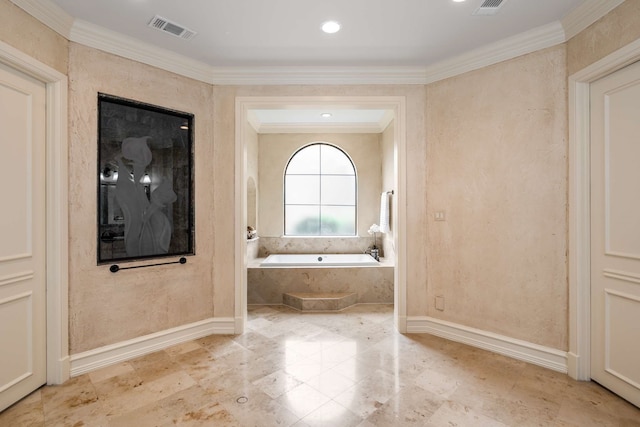 bathroom featuring ornamental molding and tiled bath