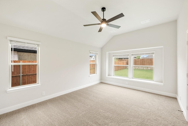 unfurnished room featuring lofted ceiling, ceiling fan, and carpet floors