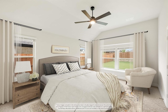 bedroom with ceiling fan, light carpet, and lofted ceiling