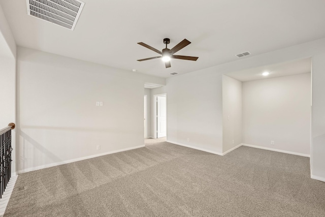 carpeted empty room with ceiling fan