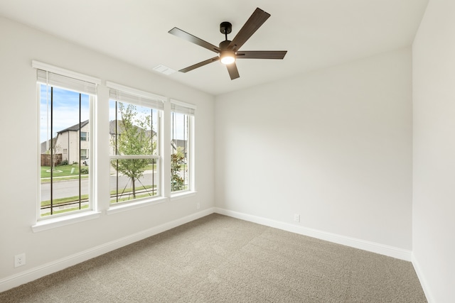 unfurnished room featuring carpet flooring and ceiling fan