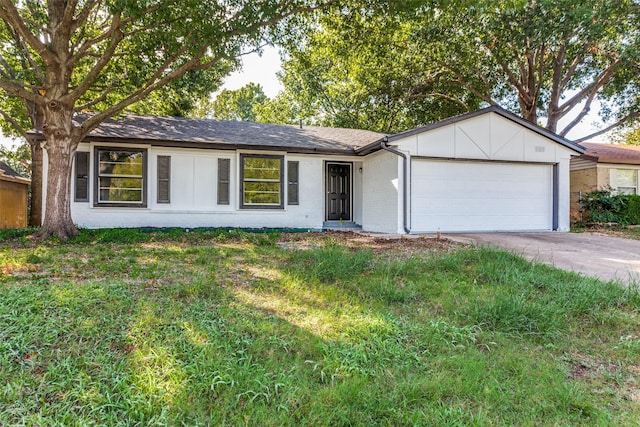 ranch-style home featuring concrete driveway, brick siding, and a garage
