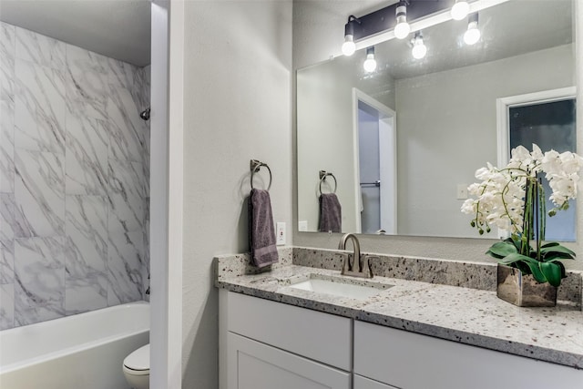 full bath featuring vanity, shower / bathtub combination, and toilet