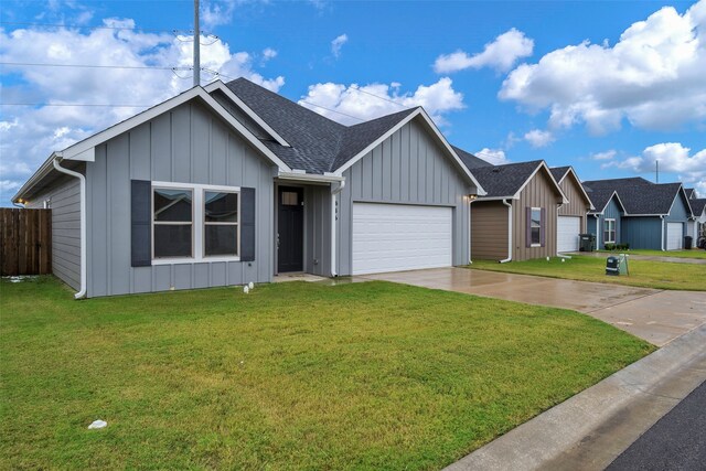 view of front facade featuring a front lawn and a garage