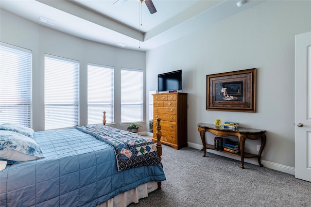 bedroom featuring ceiling fan and carpet