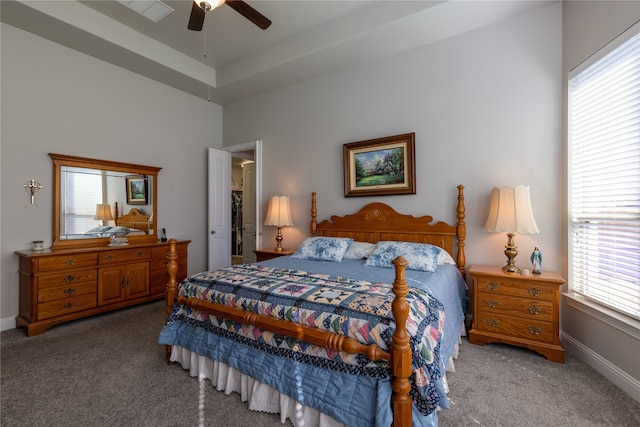 bedroom with multiple windows, carpet, and ceiling fan