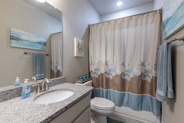 full bathroom featuring tile patterned flooring, shower / bath combo, vanity, and toilet