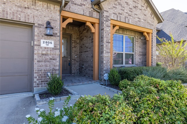 entrance to property featuring a garage