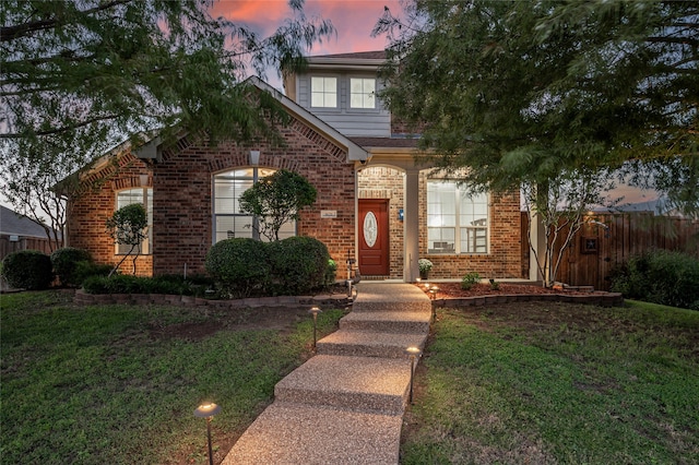 front of property featuring a lawn