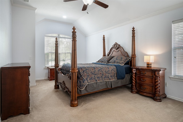 carpeted bedroom featuring ceiling fan, lofted ceiling, and ornamental molding