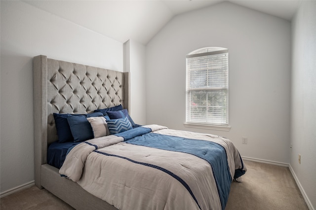 carpeted bedroom featuring vaulted ceiling