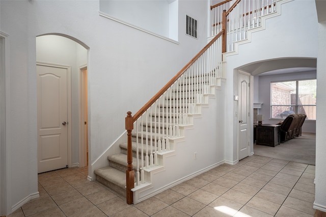 stairs with tile patterned floors