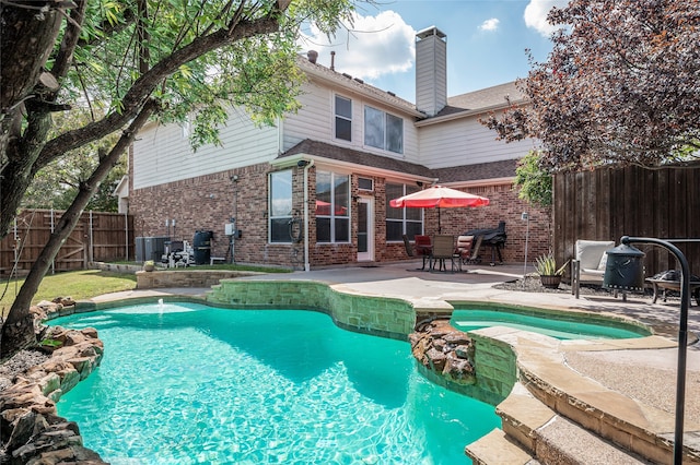 view of swimming pool with a patio