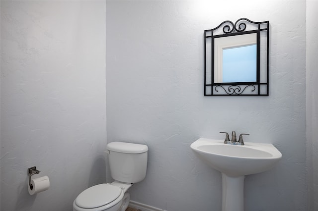 bathroom featuring toilet