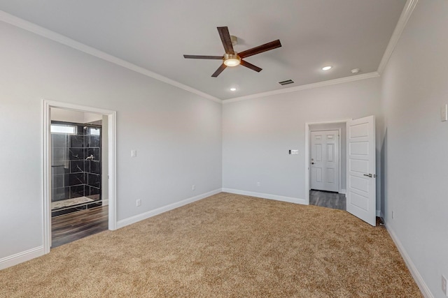 unfurnished room with ceiling fan, crown molding, and dark carpet