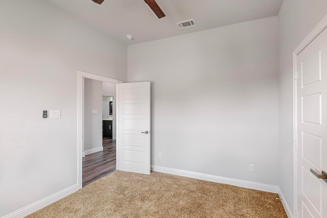 unfurnished bedroom featuring carpet and ceiling fan