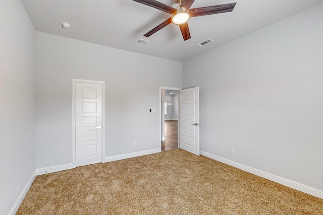 interior space with ceiling fan and carpet floors