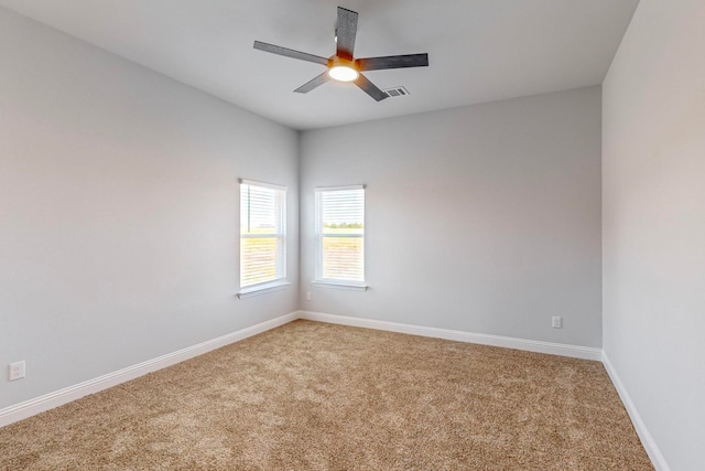 carpeted empty room with ceiling fan