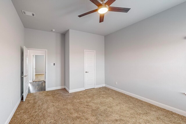 unfurnished bedroom with carpet, ceiling fan, and a closet