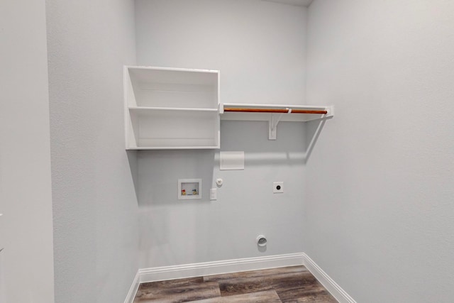 clothes washing area with hookup for a washing machine, hardwood / wood-style flooring, hookup for a gas dryer, and hookup for an electric dryer