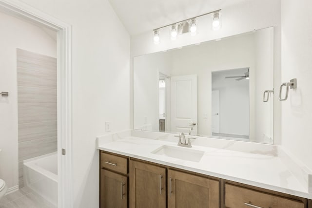 bathroom with tile patterned floors, vanity, toilet, and ceiling fan