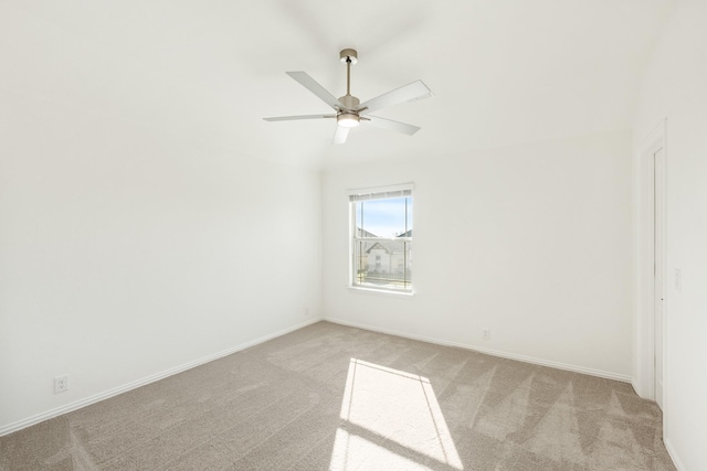 unfurnished room with ceiling fan and light colored carpet