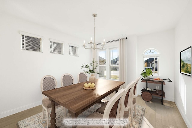 dining area featuring a chandelier and hardwood / wood-style flooring