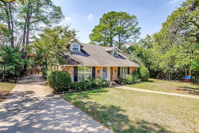 cape cod home featuring a front lawn