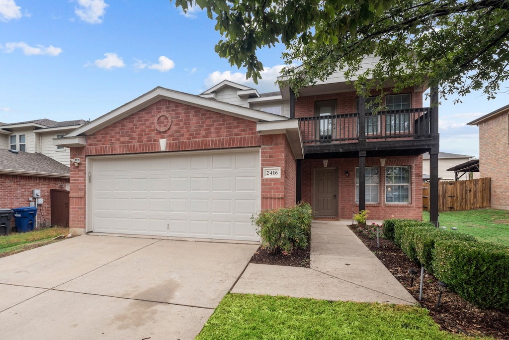 view of front of house with a balcony and a garage