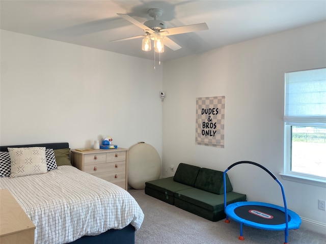 bedroom with ceiling fan and light colored carpet