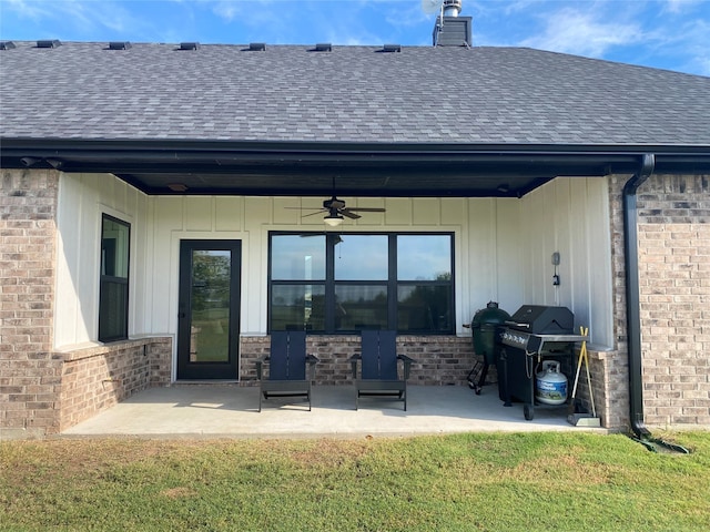 rear view of property featuring a patio, a yard, and ceiling fan