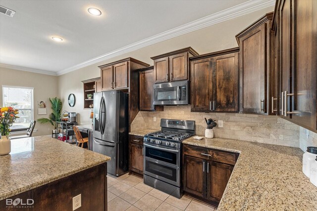 kitchen featuring sink, stainless steel appliances, a center island, crown molding, and decorative backsplash