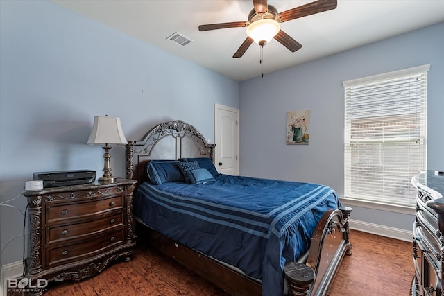 bedroom featuring ceiling fan and dark hardwood / wood-style flooring