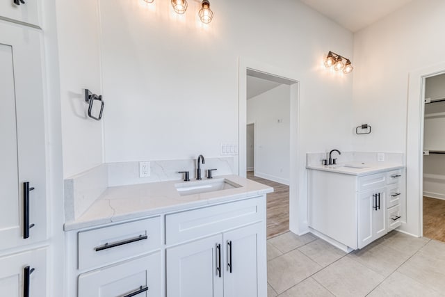 bathroom featuring wood-type flooring and vanity