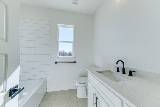 bathroom with tile patterned flooring, vanity, and toilet