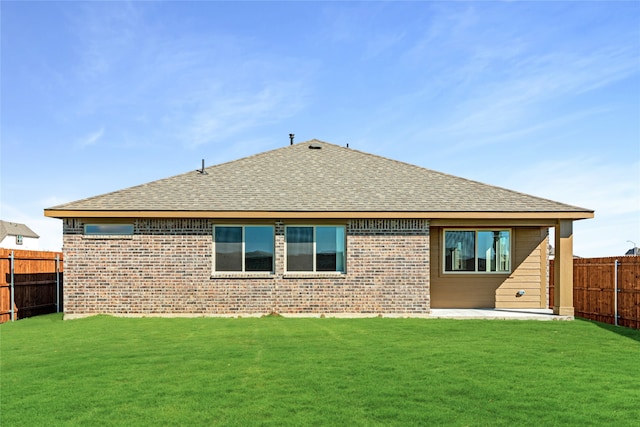 back of house featuring a yard and a patio